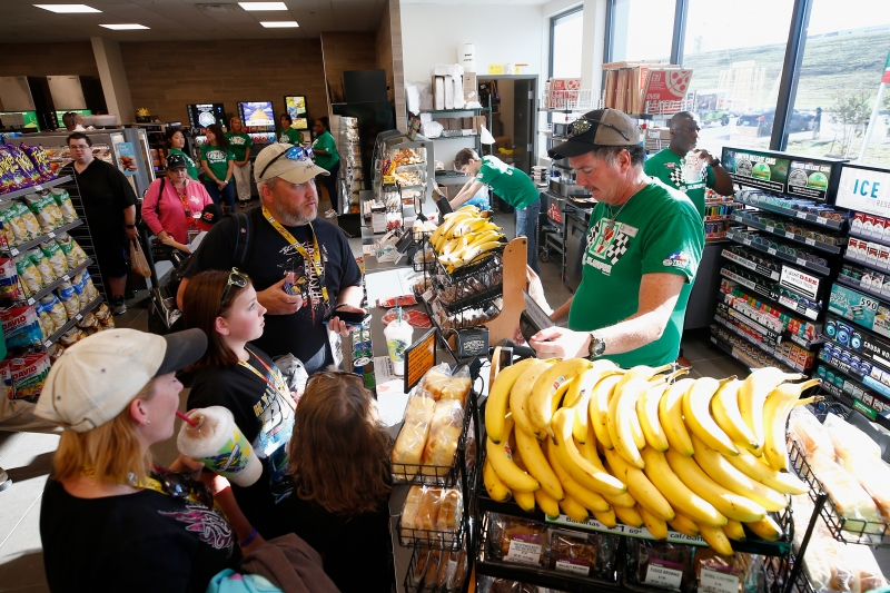 FORT WORTH, TX - NOVEMBER 02:  "Grand opening" festivities of 7-Eleven on property. General ambiance shots of fans on site, Kyle Busch autograph session, fans getting items signed, fans in M&Ms simulator or checking out show car, TMS President Eddie Gossage serving free Slurpees to fans during practice for the Monster Energy NASCAR Cup Series AAA Texas 500 at Texas Motor Speedway on November 2, 2018 in Fort Worth, Texas.  (Photo by Matt Sullivan/Getty Images)