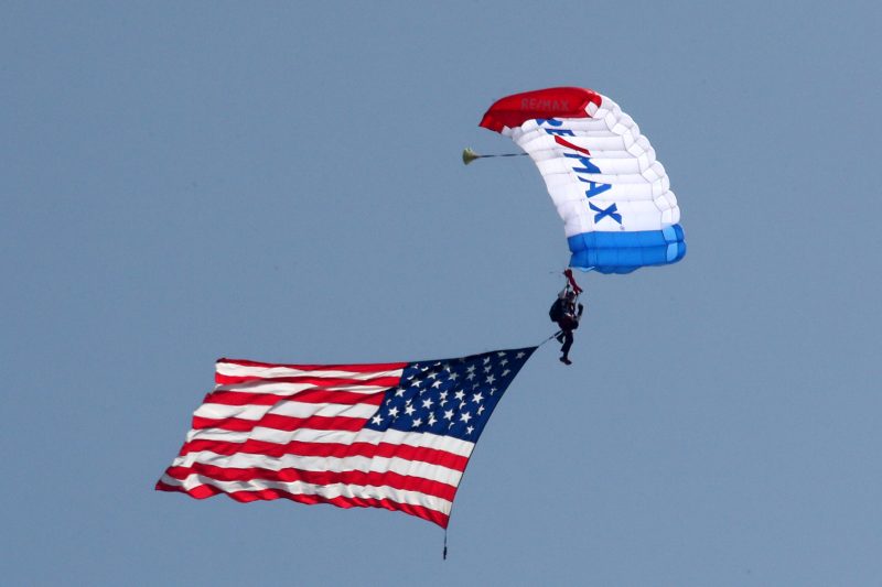 Mar 26, 2023; Austin, Texas, USA;  A member of the ReMax sky diving team before the NASCAR Cup Series EchoPark Automotive Grand Prix at the Circuit of the Americas. Credit: Michael C. Johnson