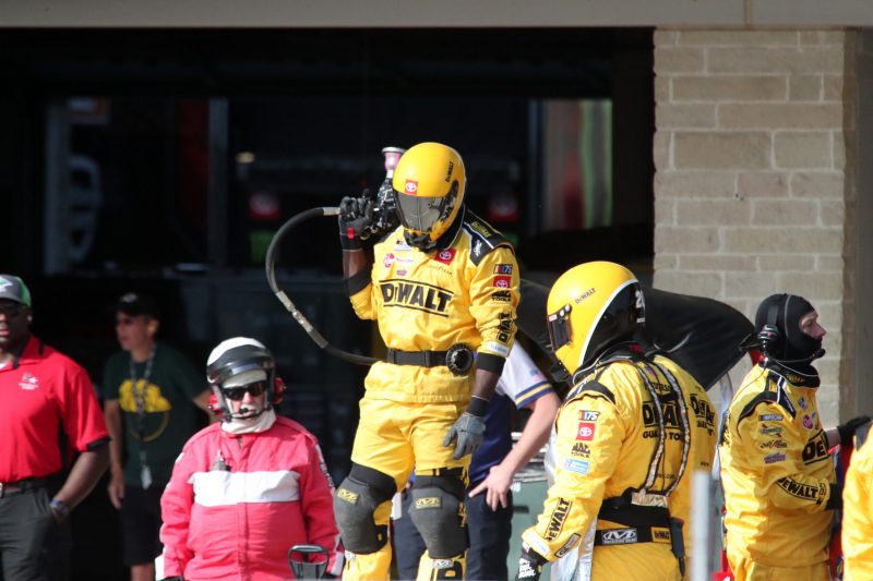Mar 26, 2023; Austin, Texas, USA;  A crew member for NASCAR Cup Series driver Christopher Bell (20) waits on a pit stop during the EchoPark Automotive Grand Prix at the Circuit of the Americas. Credit: Michael C. Johnson