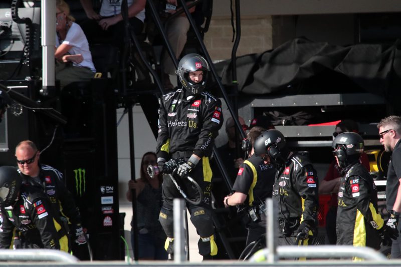 Mar 26, 2023; Austin, Texas, USA; A crew member for  NASCAR Cup Series driver Ty Gibbs (52) waits on a pit stop during the EchoPark Automotive Grand Prix at the Circuit of the Americas. Credit: Michael C. Johnson