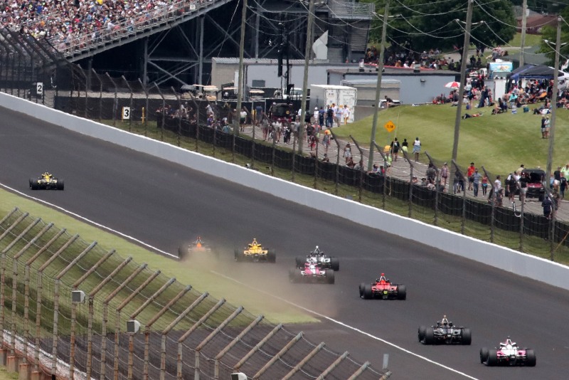 May 28, 2023; Speedway, IN, USA;  A car gets into the grass on the back straight during the 107th Indianapolis 500 by Gainbridge at the Indianapolis Motor Speedway; Credit: Michael C. Johnson