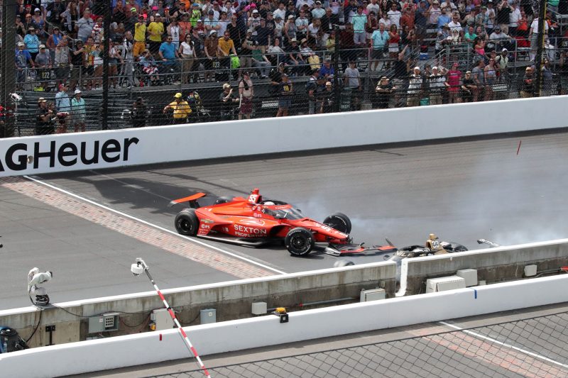 May 28, 2023; Speedway, IN, USA;  Ed Carpenter, Ed Carpenter Racing (22) and Benjamin Pedersen, AJ Foyt Enterprises (55) wreck on the front straight during the 107th Indianapolis 500 by Gainbridge at the Indianapolis Motor Speedway; Credit: Michael C. Johnson