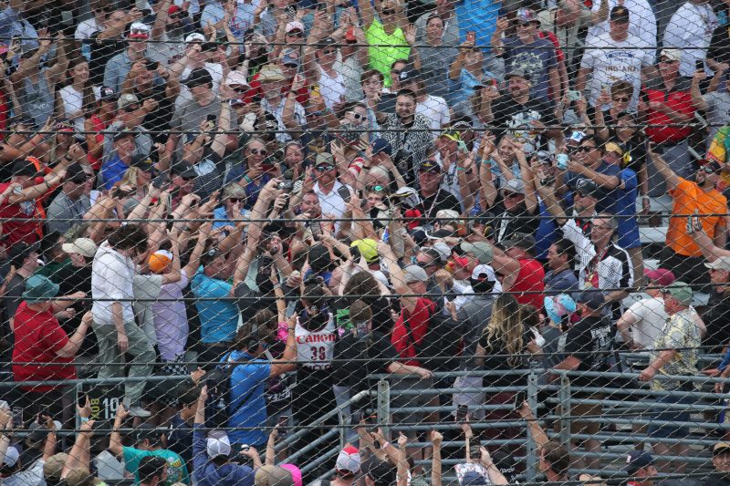 May 28, 2023; Speedway, IN, USA;  Joseph Newgarden, Team Penske (2) celebrates after winning the 107th Indianapolis 500 by Gainbridge by going into the grandstands at the Indianapolis Motor Speedway; Credit: Michael C. Johnson