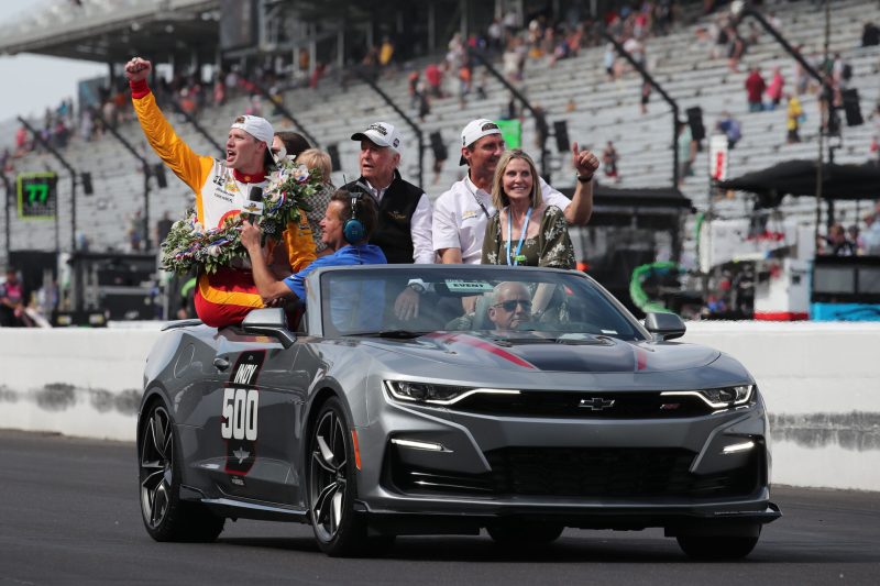 May 28, 2023; Speedway, IN, USA;  Joseph Newgarden, Team Penske (2) celebrates after winning the 107th Indianapolis 500 by Gainbridge with team and track owner Roger Penske at the Indianapolis Motor Speedway; Credit: Michael C. Johnson