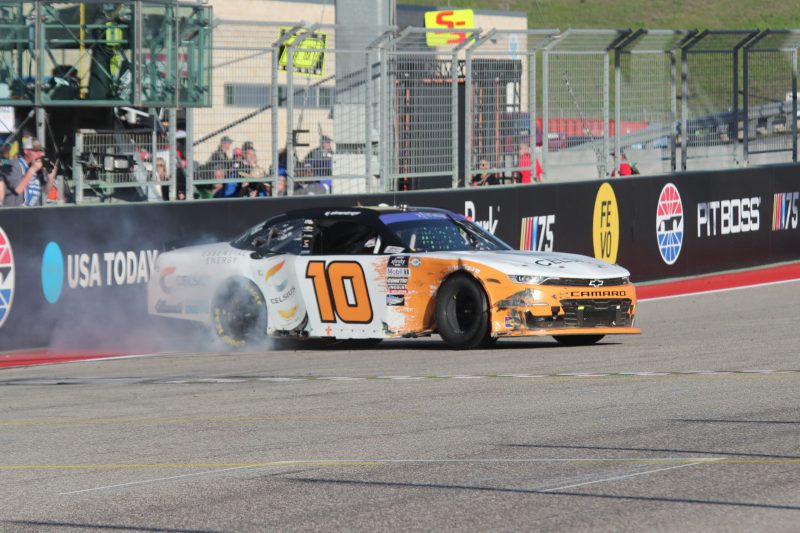 Mar 25, 2023; Austin, Texas, USA;  NASCAR Xfinity Series driver AJ Allmendinger (10) does a burn out after winning the Pit Boss 250 presented by USA Today at the Circuit of the Americas. Credit: Michael C. Johnson