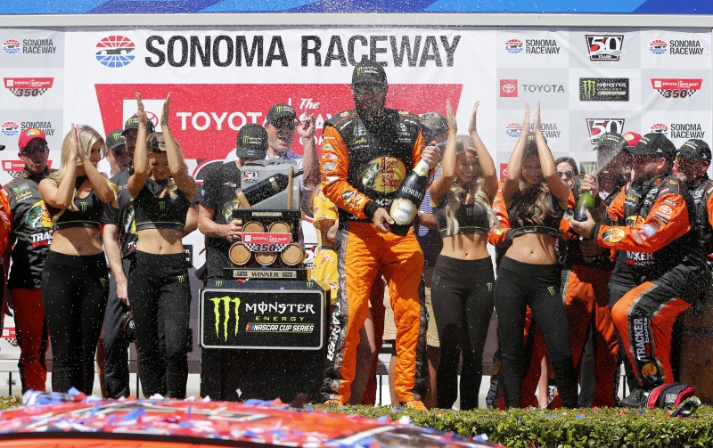 SONOMA, CALIFORNIA - JUNE 23: Martin Truex Jr., driver of the #19 Bass Pro Shops Toyota, celebrates in Victory Lane after winning the Monster Energy NASCAR Cup Series Toyota/Save Mart 350 at Sonoma Raceway on June 23, 2019 in Sonoma, California. (Photo by Jonathan Ferrey/Getty Images)