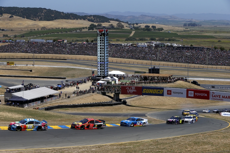 SONOMA, CALIFORNIA - JUNE 23: Kyle Busch, driver of the #18 M&M's Hazelnut Toyota, leads a pack of cars during the Monster Energy NASCAR Cup Series Toyota/Save Mart 350 at Sonoma Raceway on June 23, 2019 in Sonoma, California. (Photo by Jonathan Ferrey/Getty Images)