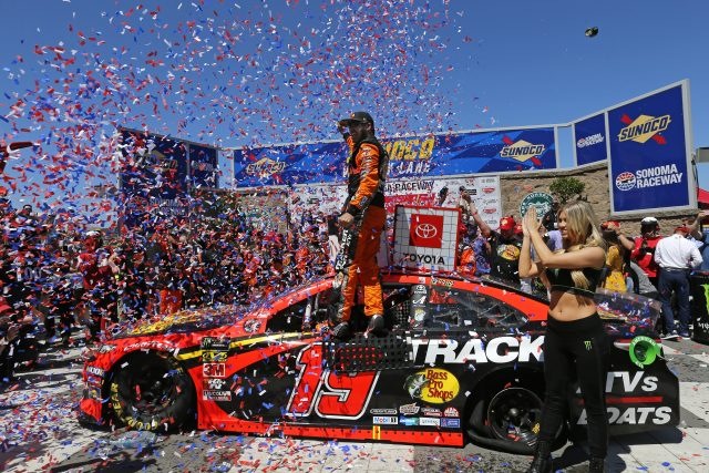 Martin Truex Jr., driver of the #19 Bass Pro Shops Toyota, celebrates in Victory Lane after winning the Monster Energy NASCAR Cup Series Toyota/Save Mart 350 at Sonoma Raceway on June 23, 2019 in Sonoma, California. (Photo by Jonathan Ferrey/Getty Images)
