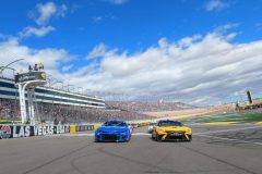 LAS VEGAS, NEVADA - MARCH 06: Christopher Bell, driver of the #20 DeWalt Toyota, and Kyle Larson, driver of the #5 HendrickCars.com Chevrolet, lead the field on a pace lap prior to the during the NASCAR Cup Series Pennzoil 400 at Las Vegas Motor Speedway on March 06, 2022 in Las Vegas, Nevada. (Photo by Meg Oliphant/Getty Images)