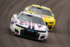 Alex Bowman, driver of the #48 Ally Chevrolet, and Joey Logano, driver of the #22 Pennzoil Ford, race during the NASCAR Cup Series Pennzoil 400 at Las Vegas Motor Speedway on March 06, 2022 in Las Vegas, Nevada. (Photo by Dylan Buell/Getty Images)