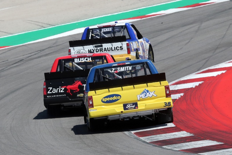 Mar 25, 2023; Austin, Texas, USA;  NASCAR Craftsman Truck Series drivers Zane Smith (38), Kyle Busch (51) and Christian Eckes (19) compete in the XPEL 225 at the Circuit of the Americas. Credit: Michael C. Johnson