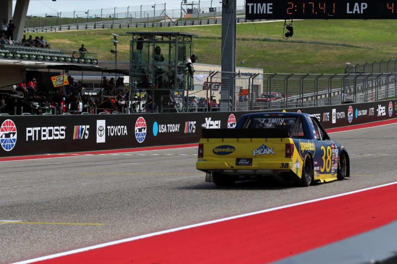 Mar 25, 2023; Austin, Texas, USA;  NASCAR Craftsman Truck Series driver Zane Smith (38) takes the white flag in the XPEL 225 at the Circuit of the Americas. Credit: Michael C. Johnson