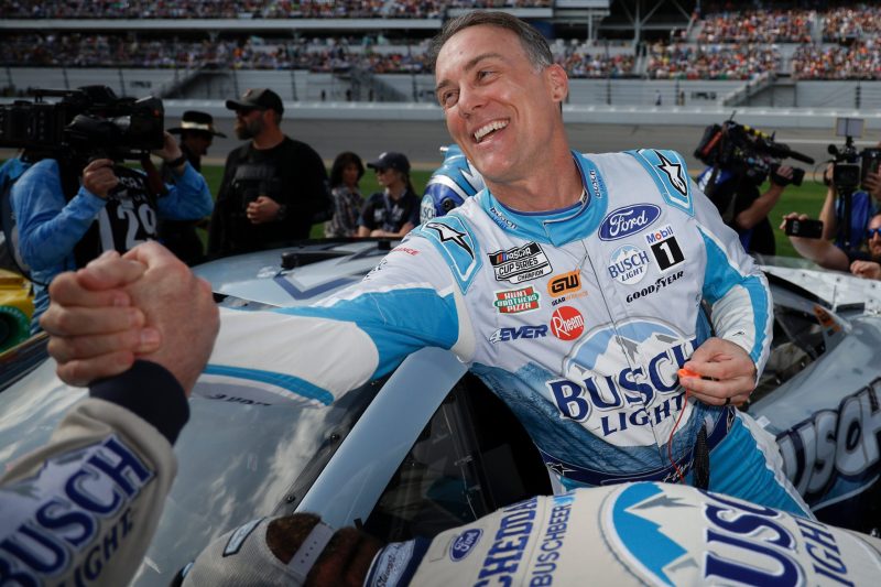 Kevin Harvick, driver of the #4 Busch Light Ford, greets a crew member prior to the NASCAR Cup Series 65th Annual Daytona 500 at Daytona International Speedway on February 19, 2023 in Daytona Beach, Florida. (Photo by Chris Graythen/Getty Images)