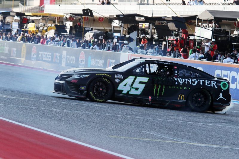 Mar 26, 2023; Austin, Texas, USA;  NASCAR Cup Series driver Tyer Reddick (45) does a burn out after the EchoPark Automotive Grand Prix at the Circuit of the Americas. Credit: Michael C. Johnson