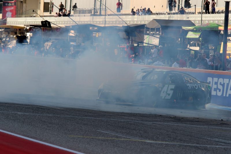 Mar 26, 2023; Austin, Texas, USA;  NASCAR Cup Series driver Tyler Reddick (45) does a burn out after the EchoPark Automotive Grand Prix at the Circuit of the Americas. Credit: Michael C. Johnson