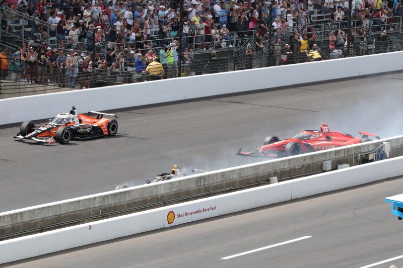 May 28, 2023; Speedway, IN, USA;  Ed Carpenter, Ed Carpenter Racing (22) and Benjamin Pedersen, AJ Foyt Enterprises (55) wreck on the front straight during the 107th Indianapolis 500 by Gainbridge at the Indianapolis Motor Speedway; Credit: Michael C. Johnson