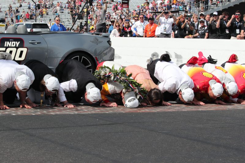 May 28, 2023; Speedway, IN, USA;  Joseph Newgarden, Team Penske (2) celebrates after winning the 107th Indianapolis 500 by Gainbridge by kissing the bricks at the Indianapolis Motor Speedway; Credit: Michael C. Johnson